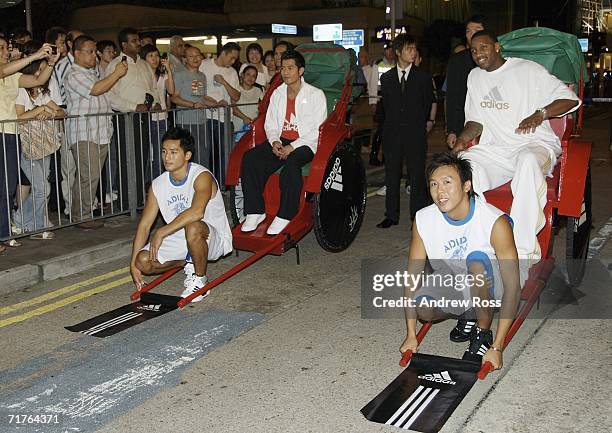 Singer Aaron Kwok and NBA player Tracy McGrady of the Houston Rockets attend the launch of new adidas shop in Tsim Tsa Tsui on August 31, 2006. In...