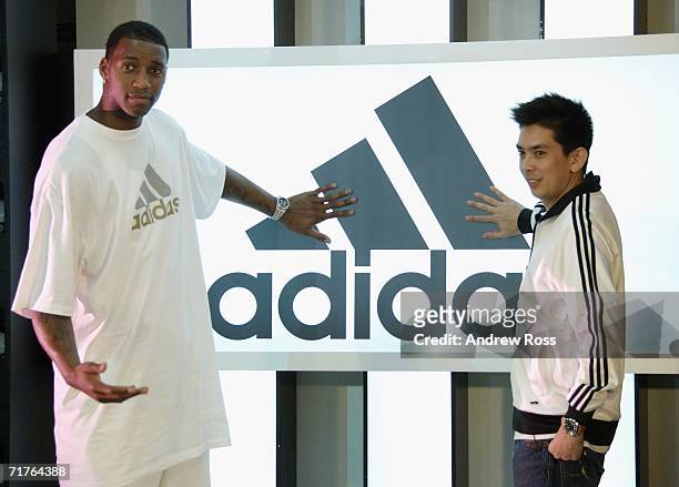 Player Tracy McGrady of the Houston Rockets and Adidas Asia-Pacific Managing Director Currie Colin attend the launch of new adidas shop in Tsim Tsa...