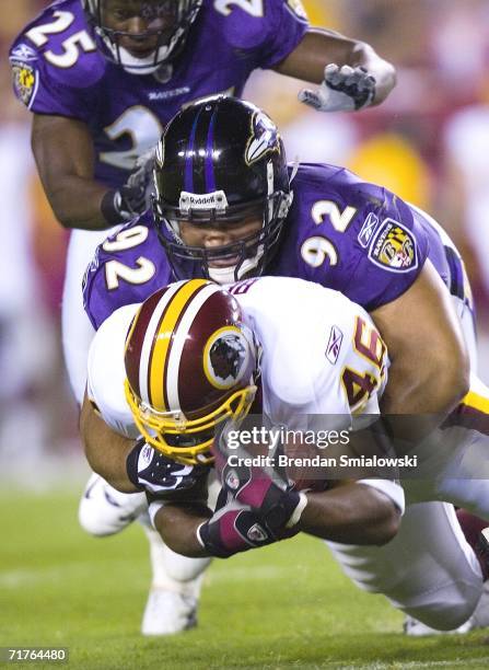 Baltimore Ravens Haloti Ngata tackles Washington Redskins Ladell Betts during the Washington Redskins vs. Baltimore Ravens game at FedEx Field August...