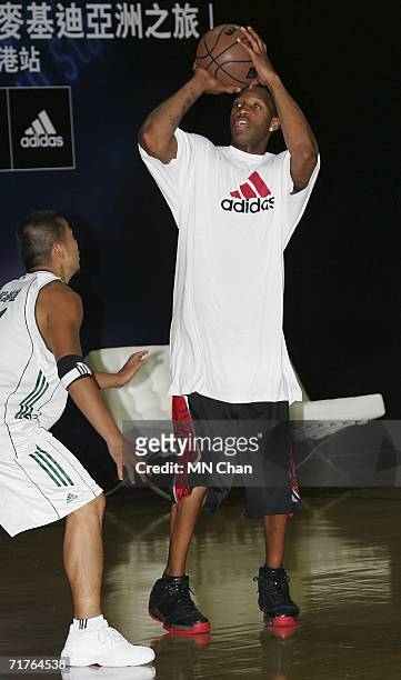 Player Tracy McGrady of the Houston Rockets demonstrates his skills during a ceremony to launch an Adidas shoe at his second visit to Hong Kong on...