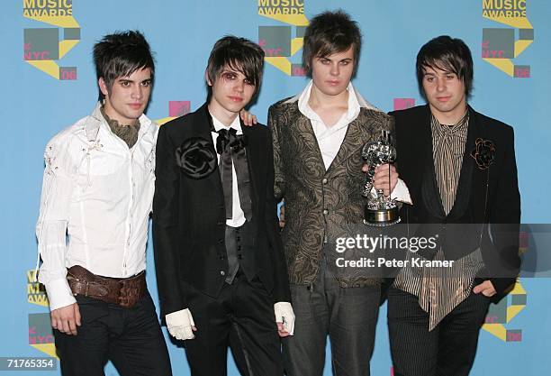 Musicians Brendon Urie, Ryan Ross, Spencer Smith and Jon Walker of Panic! At The Disco pose in the press room with their award for "Video of the...