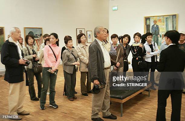 Japanese tourists visit the Edvard Munch Museum in Oslo, 01 September 2006. Edvard Munch's expressionist masterpiece "The Scream", stolen two years...