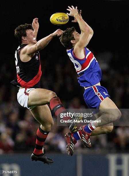 David Hille of the Bombers spoils Dale Morris of the Bulldogs during the round 22 AFL match between the Western Bulldogs and the Essendon Bombers at...