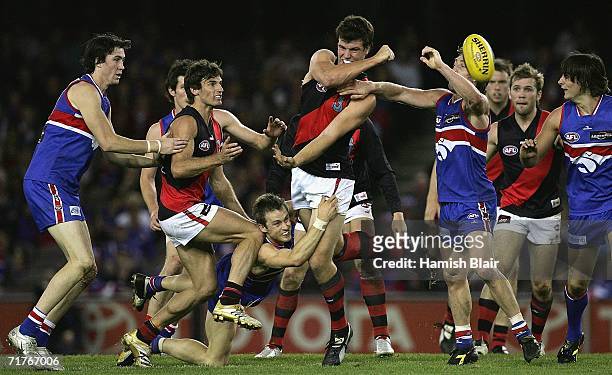 David Hille for Essendon handpasses out of the pack during the round 22 AFL match between the Western Bulldogs and the Essendon Bombers at the...