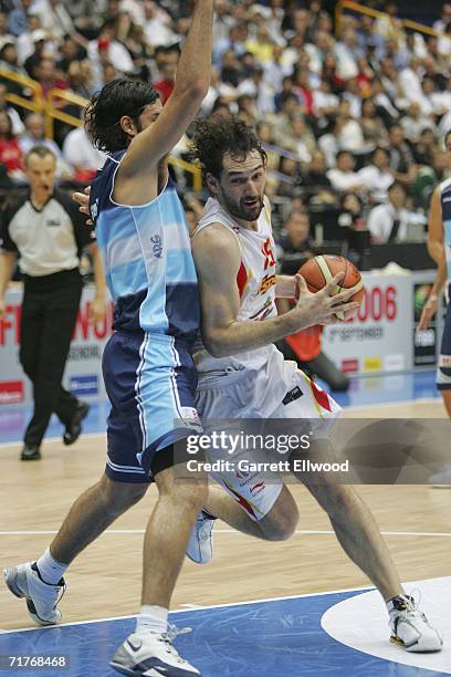 Jorge Garbajosa of Spain goes to the basket against Luis Scola of Argentina during the game against Argentina during the FIBA World Basketball...