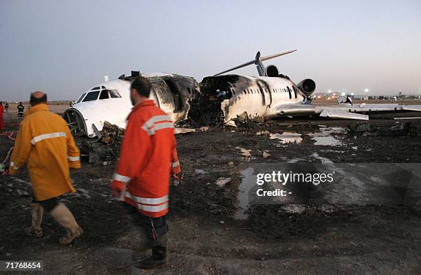 General view shows an Iranian airliner which caught fire on landing in the northeastern city of Mashhad 01 September 2006, killing 29 passengers....