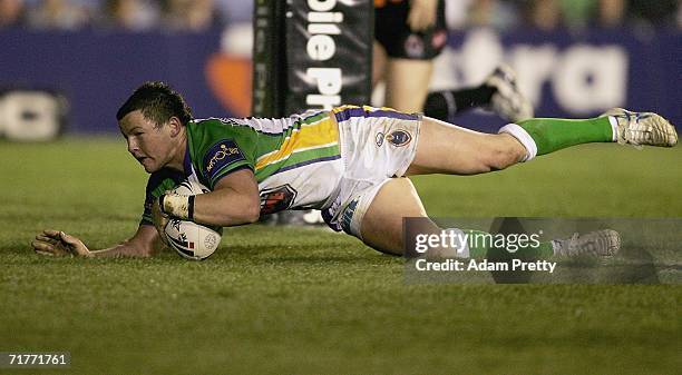 Todd Carney of the Raiders goes over for a try during the round 26 NRL match between the Cronulla-Sutherland Sharks and the Canberra Raiders at...