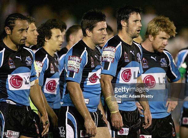 Phil Bailey and the Sharks look dejected during the round 26 NRL match between the Cronulla-Sutherland Sharks and the Canberra Raiders at Toyota Park...