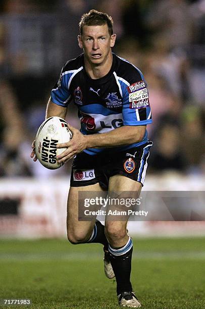 Adam Dykes of the Sharks runs with the ball during the round 26 NRL match between the Cronulla-Sutherland Sharks and the Canberra Raiders at Toyota...