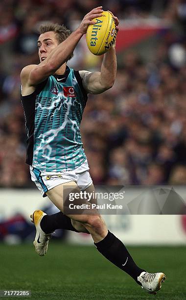 Brett Ebert of the Power gathers the ball during the round 22 AFL match between the Fremantle Dockers and the Port Adelaide Power at Subiaco Oval...