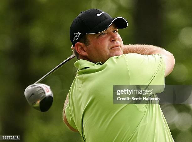 Jason Gore watches his tee shot on the 12th hole during the first round of the Deutsche Bank Championship at the TPC of Boston on September 1, 2006...