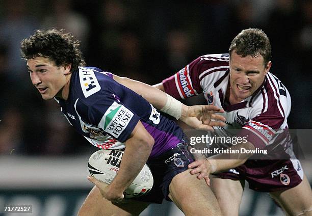 Billy Slater of the Storm is chased by Matt Orford of the Sea Eagles during the round 26 NRL match between the Melbourne Storm and the Manly...