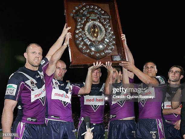 Melbourne Storm players lift the JJ Giltinan Shield after the round 26 NRL match between the Melbourne Storm and the Manly Warringah Sea Eagles at...