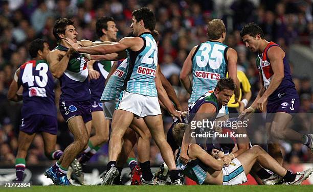 Dockers and Power players wrestle during the round 22 AFL match between the Fremantle Dockers and the Port Adelaide Power at Subiaco Oval September...