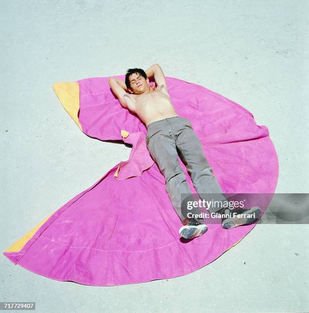 Spanish bullfighter Sebastián Palomo Martínez , known professionally as Palomo Linares, lying on his cape during a break in a training session,...