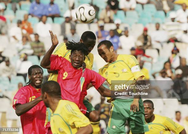 Chris Samba and Destin Makita of Congo challenge for the ball with Benson Mhlongo and Nasief Morris of South Africa during the African Nations Cup...