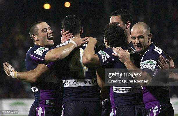 Melbourne Storm players celebrate a try during the round 26 NRL match between the Melbourne Storm and the Manly Warringah Sea Eagles at Olympic Park...