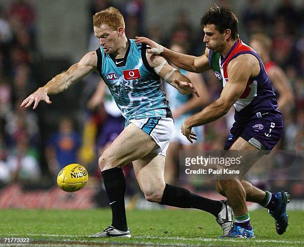 Peter Walsh of the Power and Heath Black of the Dockers contest the ball during the round 22 AFL match between the Fremantle Dockers and the Port...