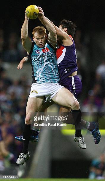 Peter Walsh of the Power marks in front of Heath Black of the Dockers during the round 22 AFL match between the Fremantle Dockers and the Port...