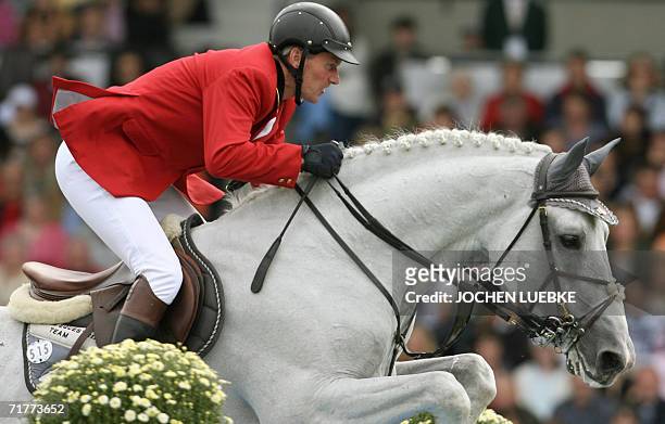 Belgian rider Jos Lansink on "Cavalor Cumano" competes in the Jumping Individual Classification of the World Equestrian Games in Aachen 02 September...