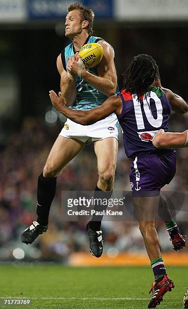 Dean Brogan of the Power marks the ball during the round 22 AFL match between the Fremantle Dockers and the Port Adelaide Power at Subiaco Oval on...