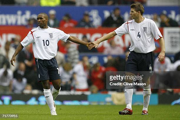 Jermain Defoe of England is congratulated by team mate Steven Gerrard after scoring his team's third goal during the Euro 2008 Qualifying match...