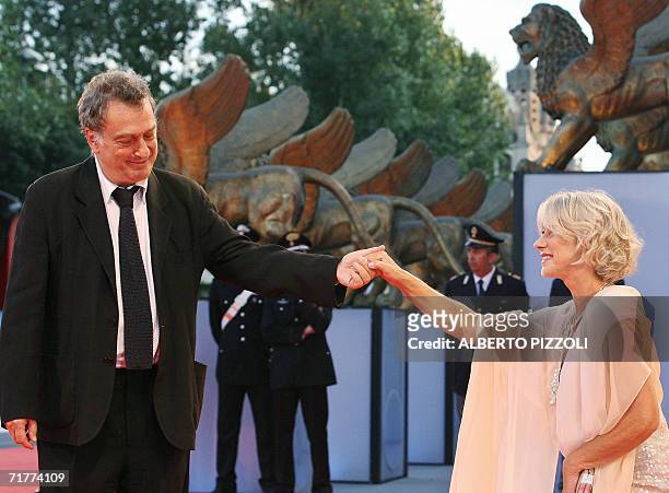 British actress Helen Mirren and director Stephen Frears joke as they arrive for the screening of "The Queen" at the Lido of Venice, 02 September...