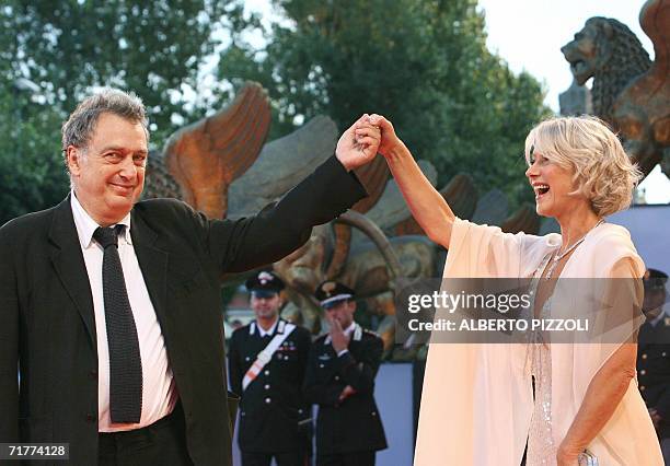 British actress Helen Mirren and director Stephen Frears joke as they arrive for the screening of "The Queen" at the Lido of Venice, 02 September...