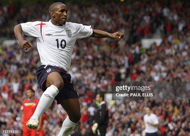 Manchester, UNITED KINGDOM: England's Jermain Defoe celebrates scoring against Andorra during their European Championship qualifying match at Old...