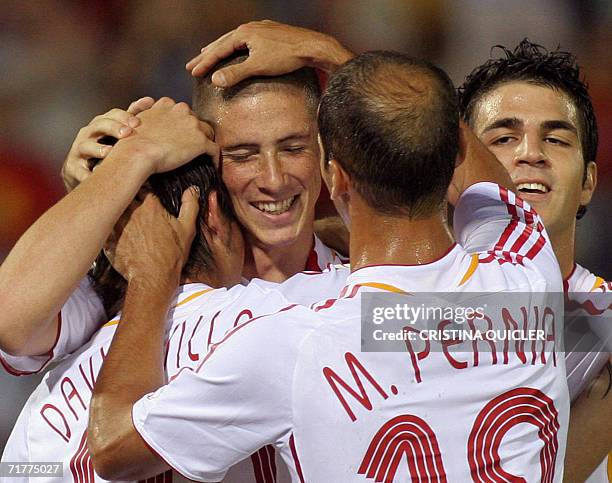 Spain's Fernando Torre celebrates after scoring against Liechtenstein with teammates, Cesc , Pernia and David Villa during a Euro2008 qualifying...
