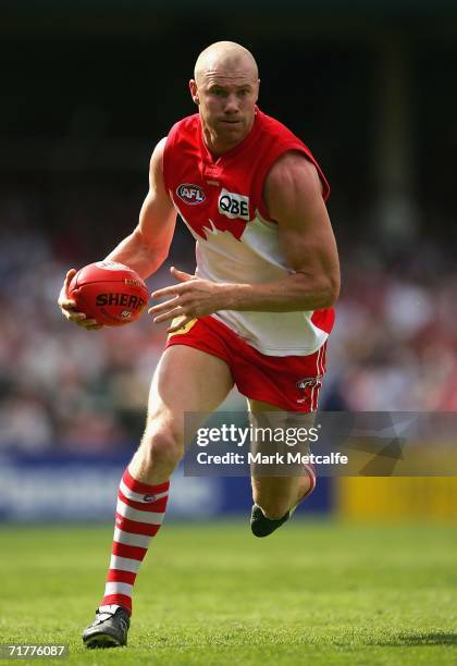 Barry Hall of the Swans runs with the ball during the round 22 AFL match between the Sydney Swans and the Carlton Blues at the Sydney Cricket Ground...