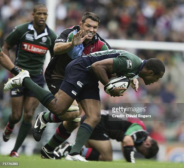 Sailosi Tagicakibau of London Irish is tackled by Nicolas Spanghero of Harlequins during the Guinness Premiership match between London Irish and NEC...