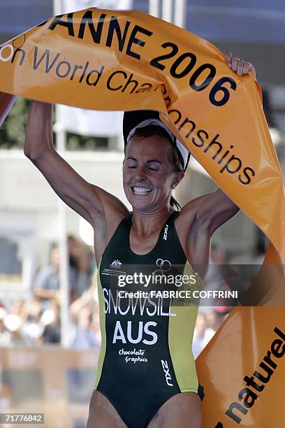 Lausanne, SWITZERLAND: Emma Snowsill of Australia celebrates her victory after she won the Women's elite Triathlon World Championships 03 September...