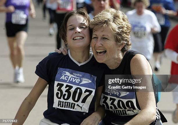 Runners congratulate each other after finishing the 5km run during the Lucozade Hydro Active Womens Challenge in Hyde Park on September 3, 2006 in...