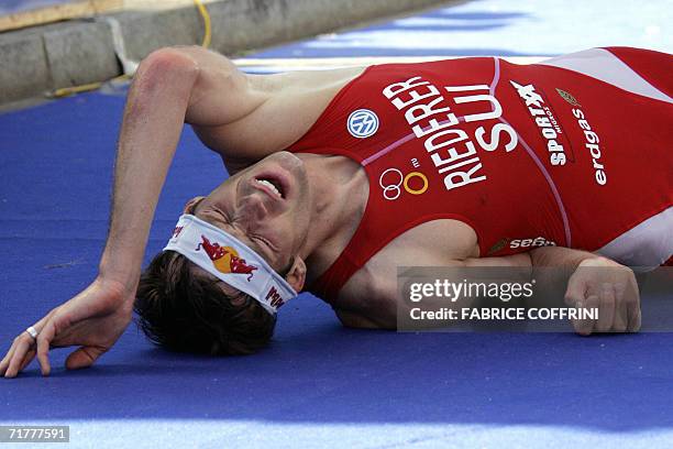 Lausanne, SWITZERLAND: Sven Riederer of Switzerland recovers after he finished 12th place in the Men's Elite Triathlon World Championships 03...