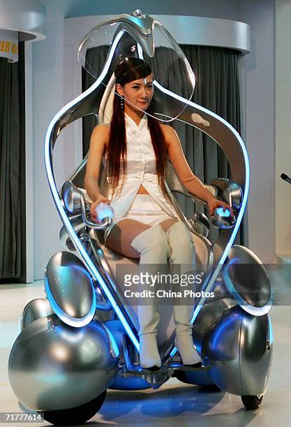 Model drives the "I-Unit" concept car of Toyota Motor at the 2nd China Jilin Northeast Asia Investment and Trade Expo on September 3, 2006 in...