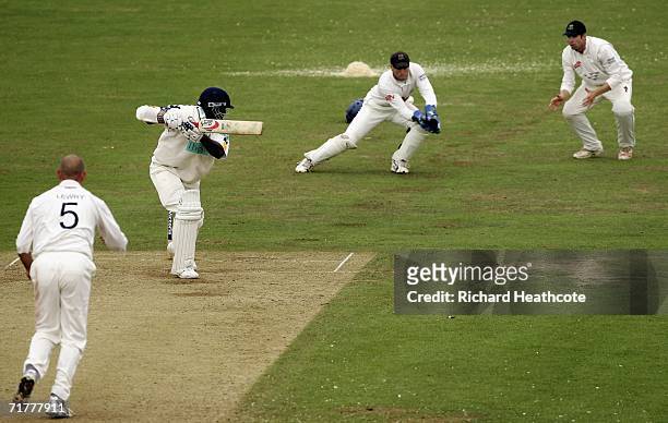 Michael Carberry of Hants loses his wicket by edging the ball to Matt Prior off the bowling of Jason Lewry during the Liverpool Victoria Division One...