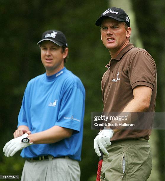 Ryder Cup team members Robert Karlsson of Sweden and J.J. Henry wait on the second tee during the third round of the Deutsche Bank Championship on...