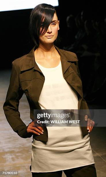 Model parades an outfit by Australian label United Construction during a New Generation show at Australian Fashion Week, in Melbourne 04 September...