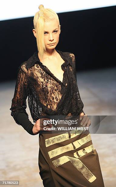 Model parades an outfit by Australian label United Construction during a New Generation show at Australian Fashion Week, in Melbourne 04 September...