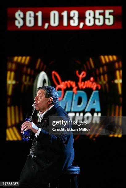 Entertainer Jerry Lewis jokes by spilling his bottle of water at the end of the 41st annual Labor Day Telethon to benefit the Muscular Dystrophy...