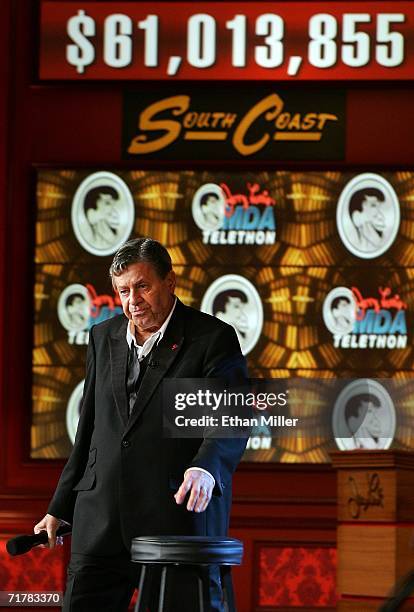 Entertainer Jerry Lewis walks in front of the tote board displaying the record USD 61 855 raised during the 41st annual Labor Day Telethon to benefit...