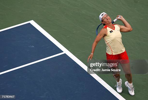 Martina Navratilova serves while playing with her partner Bob Bryan against Tiantian Sun of China and Julian Knowle of Austria during the U.S. Open...