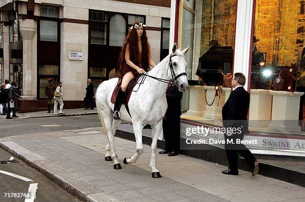 The Lady Godiva, Laurella Fox-Pitt, arrives on a horse to the Swaine Adeney Brigg store for the 'Best In Show' Launch Party, at Swaine Adeney Brigg...