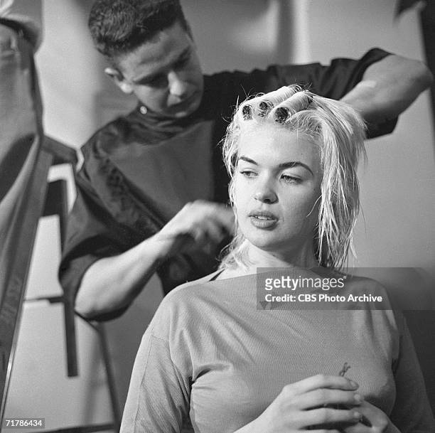 American actress Jayne Mansfield has her hair done at home as she prepares for her appearance on the CBS television program 'Person to Person,' May...