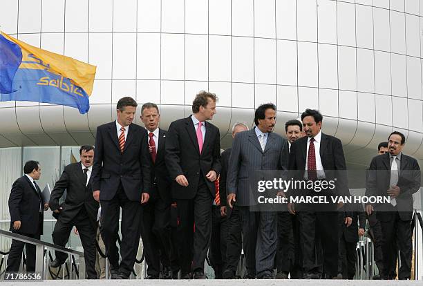 Prince Saud bin Abdullah bin Thunayan Al-Saud from Saudi-Arabia and Dutch minister of Economic Affairs Joop Wijn flanked by unidentified officials...