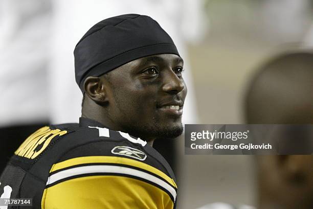 Wide receiver Santonio Holmes of the Pittsburgh Steelers smiles while on the sideline during a preseason game against the Carolina Panthers at Heinz...