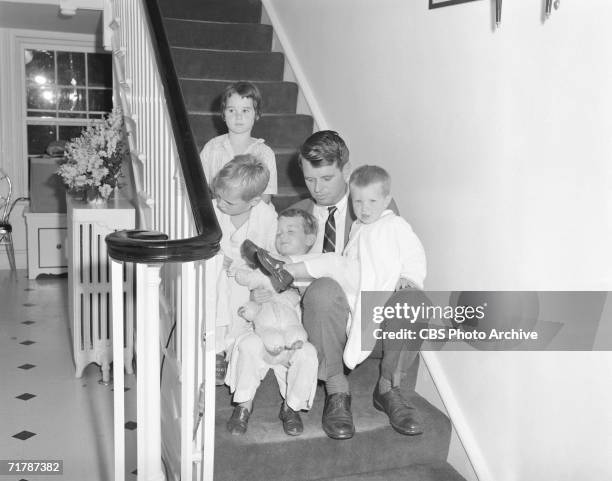 American lawyer and later politician Robert Kennedy sits with four of his eventually eleven children, Kathleen, Joseph, Robert Jr., and David , on...
