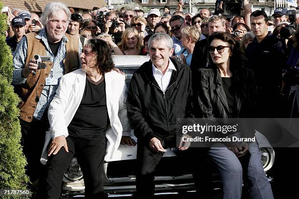 The city of Deauville pays homage to the director Claude Lelouch as he poses with director/composer Pierre Barouh , composer Francis Lai and Anouk...