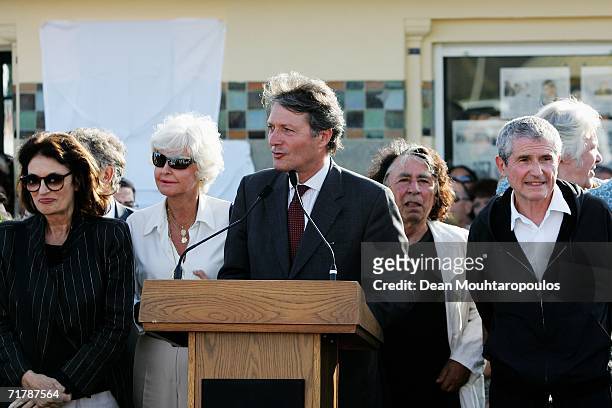 Deauville mayor Philippe Augier speaks about Director Claude Lelouch as Anouk Aimee looks on at the 32nd Deauville Festival Of American Film as the...